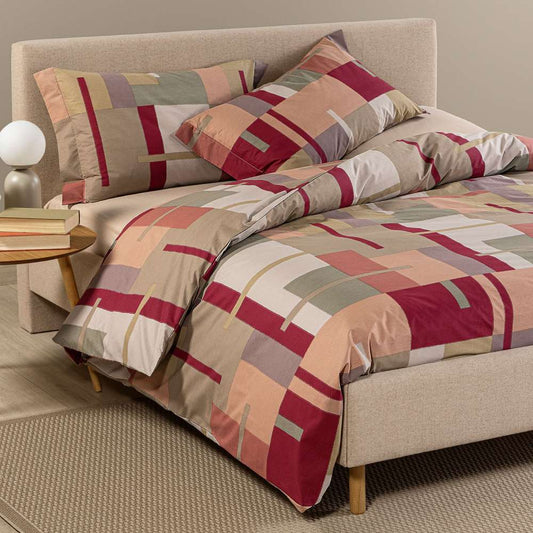 Copripiumino Caleffi Lennox in cotone, fantasia geometrica corallo bordeaux. Per letto piazza e mezza e matrimoniale.
