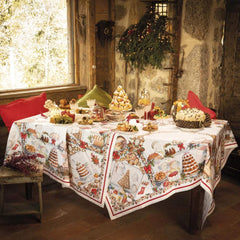 Tovaglia natalizia Noel Gourmand in puro lino di Tessitura Toscana Telerie. Fantasia su fondo chiaro, con scene che ritraggono dolci natalizi e tavole imbandite nel periodo di Natale. Le scene ritratte sono ricche di dettagli e fanno respirare aria di festa. La fantasia è incorniciata da una riga rossa e da una ghirlanda di biscotti a tema natalizio. Misura rettangolare x12 (170x270 cm).