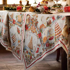 Tovaglia natalizia Noel Gourmand in puro lino di Tessitura Toscana Telerie. Fantasia su fondo chiaro, con scene che ritraggono dolci natalizi e tavole imbandite nel periodo di Natale. Le scene ritratte sono ricche di dettagli e fanno respirare aria di festa. La fantasia è incorniciata da una riga rossa e da una ghirlanda di biscotti a tema natalizio. Misura rettangolare x12 (170x270 cm). Dettaglio.