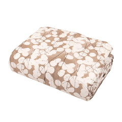 Trapunta primaverile matrimoniale Fazzini Lunaria, in percalle di puro cotone. Il trapuntino Lunaria presenta una fantasia floreale dallo stile moderno, con fiori chiari su fondo tortora. Quilt