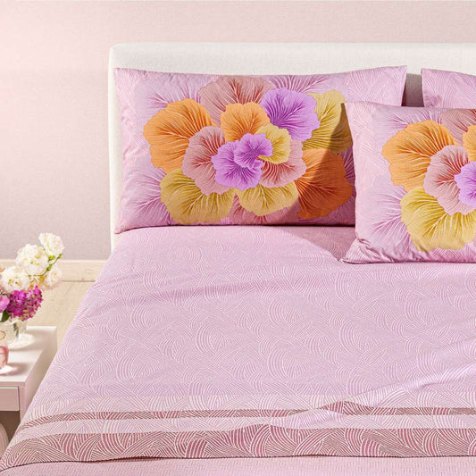 completo lenzuola madreperla caleffi. Federe con grande fiore rosa e arancio. Lenzuola con fantasia rosa a intrecci