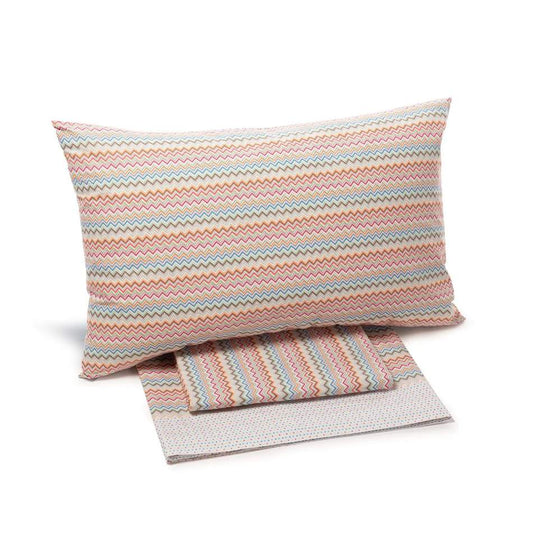 Completo lenzuola matrimoniale Interni di Caleffi, in 100% puro cotone Il completo lenzuola Interni presenta una vivace fantasia geometrica multicolore nella variante corallo arancione