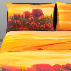 Lenzuola Copriletto matrimoniale in cotone Caleffi Papaveri. Completo lenzuola copriletto fantasia arancione con papaveri rossi e tramonto