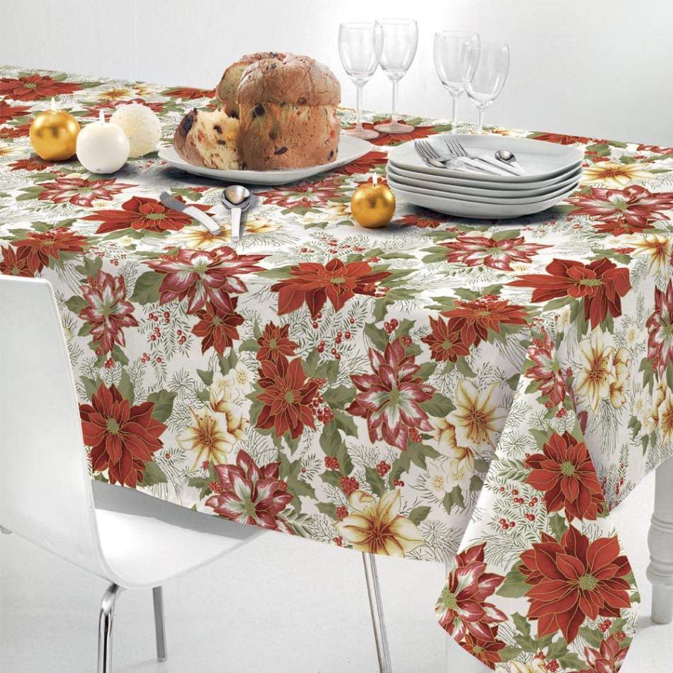 Tovaglia natalizia Bijoux di Gabel-Vallesusa in puro cotone. Misura rettangolare. Fantasia floreale che presenta i tipici colori del Natale, con fiori rossi e bianchi e foglie verdi.