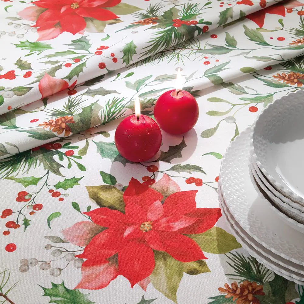 Tovaglia natalizia Stella di Gabel Vallesusa. Fantasia floreale natalizia. Fondo bianco con stelle di natale rosse e foglie verdi.