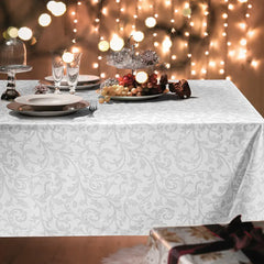 Tovaglia natalizia Oriente di Gabel-Vallesusa in cotone. Fantasia damascata grigio platino su fondo bianco.