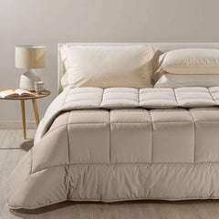 Trapunta invernale matrimoniale Bicolor di Caleffi, in puro cotone tinta unita doubleface. Piumone colore naturale tortora