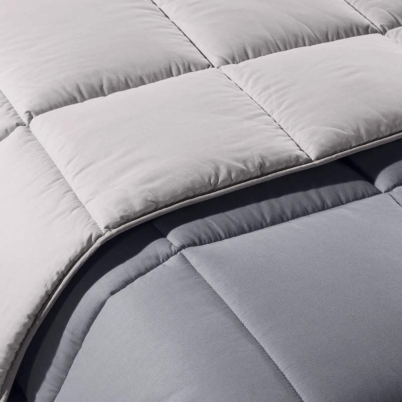 Trapunta invernale matrimoniale Bicolor di Caleffi, in puro cotone tinta unita double face. Piumone colore grigio.