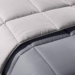 Trapunta invernale matrimoniale Bicolor di Caleffi, in puro cotone tinta unita double face. Piumone colore grigio.