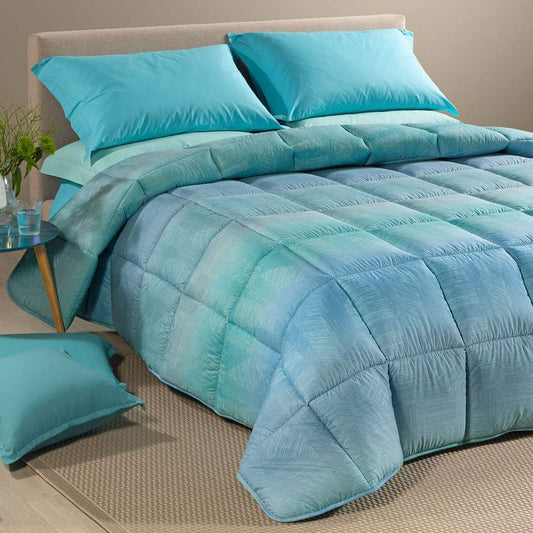 Trapunta invernale Atlantis Caleffi. Piumone fantasia geometrica variante azzurro avio