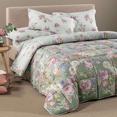 Trapunta invernale matrimoniale Caleffi Giardino Romantico in cotone.
Piumone fantasia con fiori colorati su fondo verde giada.