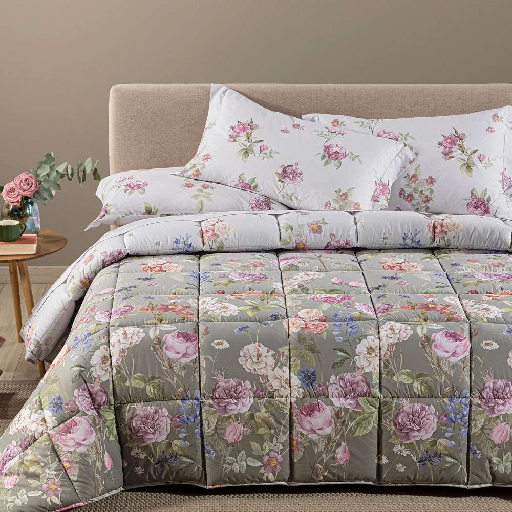 Trapunta invernale matrimoniale Caleffi Giardino Romantico in cotone.
Piumone fantasia con fiori colorati su fondo tortora.