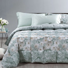 Trapunta invernale matrimoniale Caleffi Kyoto Flowers in cotone.
Piumone fantasia fiori chiari su fondo verde anice.