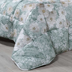 Trapunta invernale matrimoniale Caleffi Kyoto Flowers. Piumone fantasia fiori chiari su fondo verde anice.