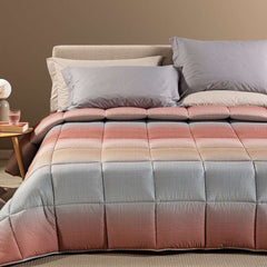 Trapunta Invernale caleffi Larry. piumone fantasia geometrica effetto degrade, variante corallo.