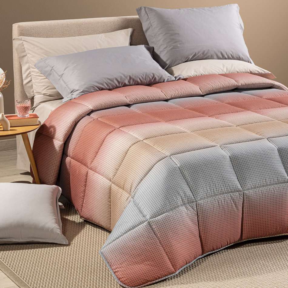 Trapunta Invernale caleffi Larry. piumone fantasia geometrica effetto degrade, variante corallo.