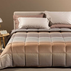 Trapunta Invernale caleffi Larry. piumone fantasia geometrica effetto degrade, variante gold. Per letto singolo, piazza e mezza e matrimoniale