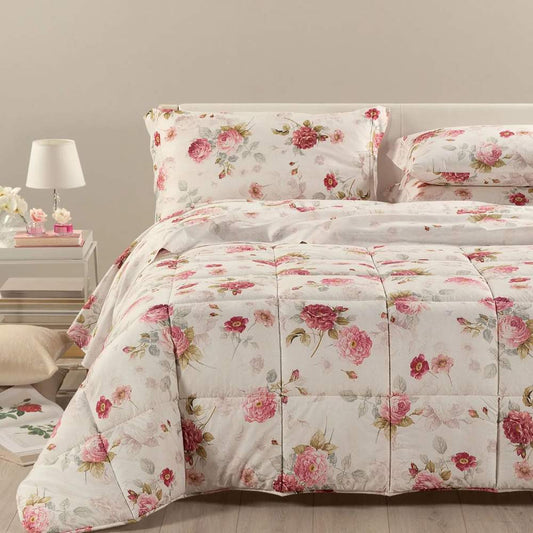 Trapunta invernale matrimoniale Caleffi Eden Rose, in puro cotone con stampa digitale. il piumone Eden Rose presenta una delicata fantasia floreale, con rose rosse su su fondo avorio.