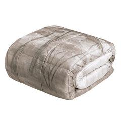 Trapunta invernale matrimoniale Fazzini Nemora, in raso di cotone. Piumone in fantasia torrone beige con natura e alberi stile acquerello.