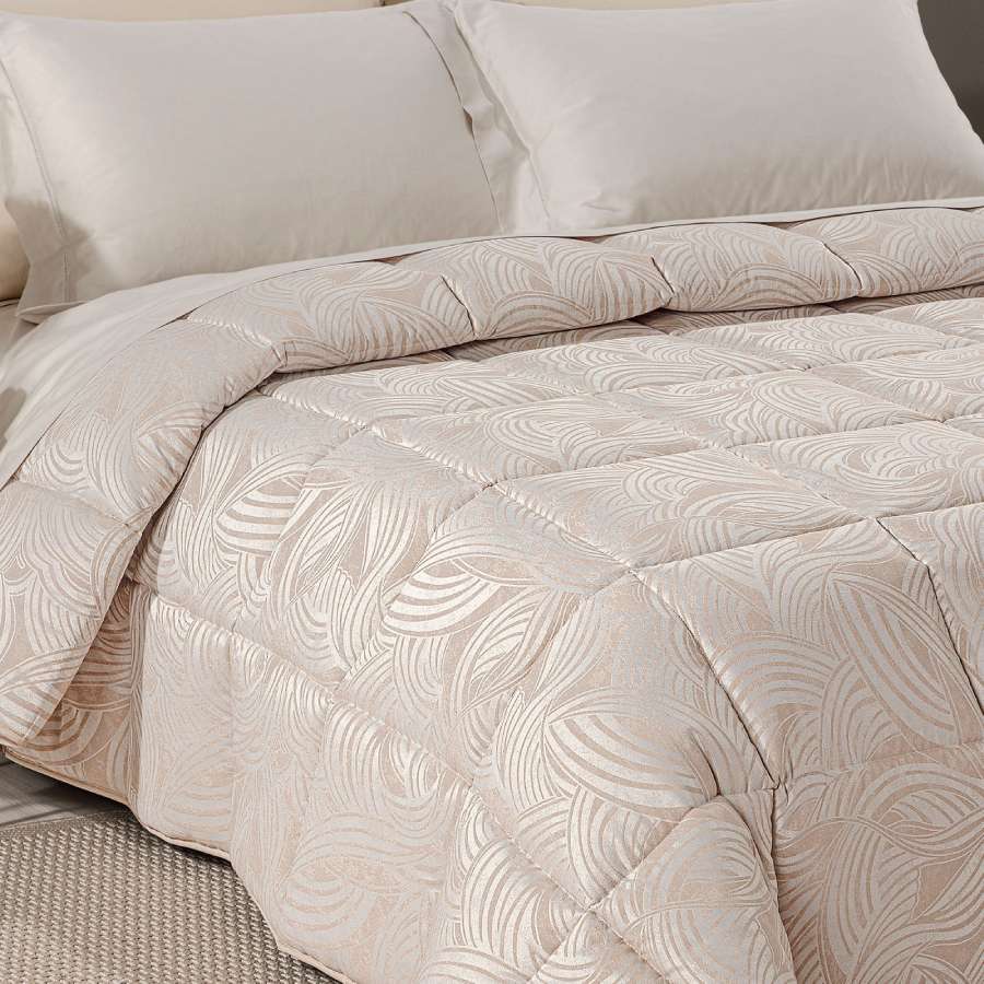 Trapunta invernale matrimoniale Caleffi Apollo piumone in raso jacquard. fantasia geometrica naturale, con forme curve.