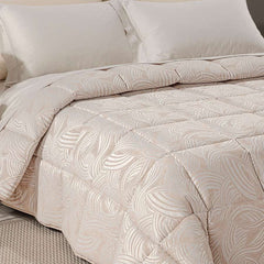 Trapunta invernale matrimoniale Caleffi Apollo piumone in raso jacquard. fantasia geometrica naturale, con forme curve.