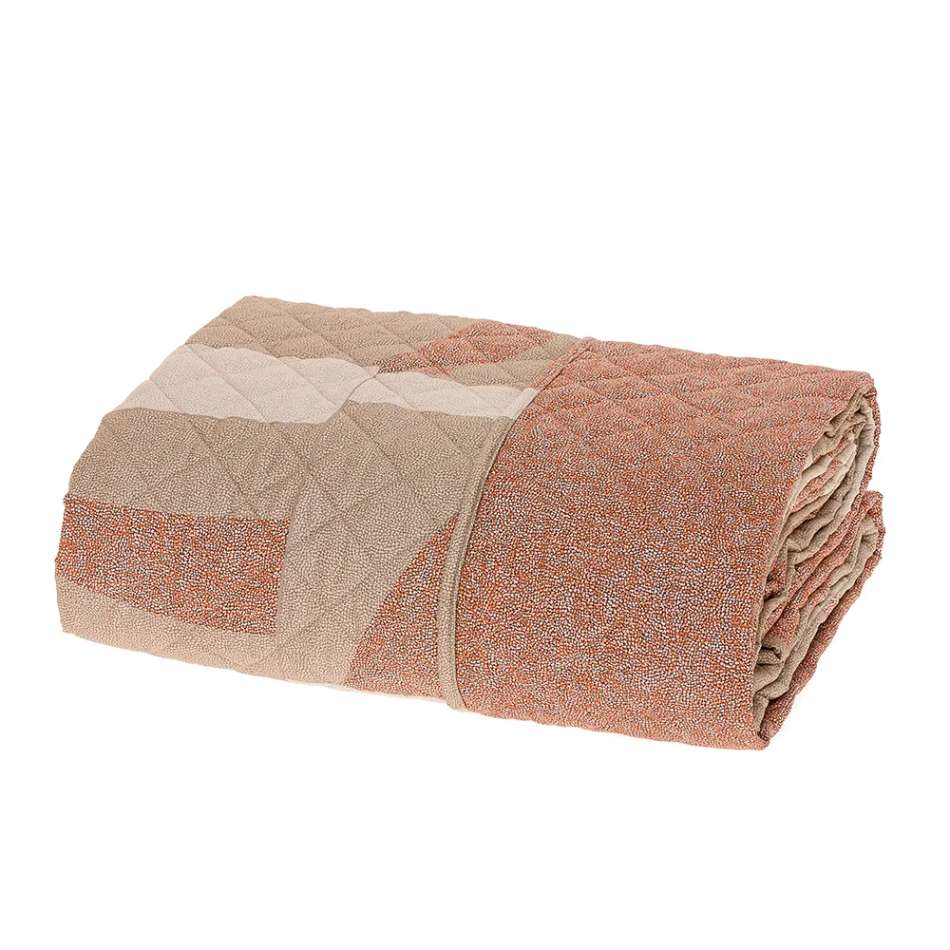 Borbonese. fantasia con forme geometriche beige e rossicce su fondo tortora chiaro. L'altra faccia invece presenta la fantasia Borbonese nella variante mattone/ruggine/rossiccia
