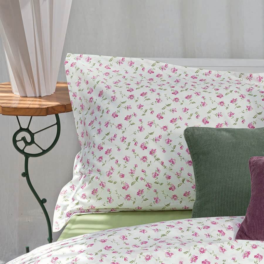 Completo lenzuola fazzini Ninfeo in cotone. Fantasia con fiori rosa su fondo bianco. Misura letto singolo e matrimoniale.