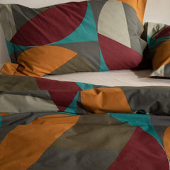 Copripiumino matrimoniale Caleffi Colorama, in puro cotone anallergico e traspirante. Fantasia geometrica e moderna, colore rubino, arancio