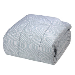 Trapunta invernale Fazzini Plops in percalle di puro cotone. Disponibile nella misura matrimoniale e piazza e mezza. Moderna fantasia geometrica colore frozen grigio