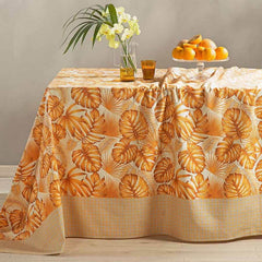Telo Arredo multiuso Foglie di Caleffi, in puro cotone. Fantasia con bordo geometrico e foglie stampate sul resto del telo. Colore arancio.