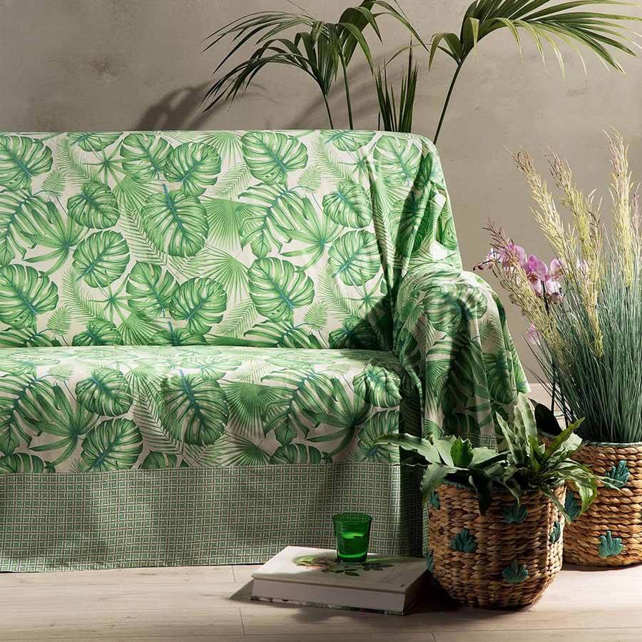 Telo Arredo multiuso Foglie di Caleffi, in puro cotone. Fantasia con bordo geometrico e foglie stampate sul resto del telo. Colore verde.