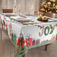 Tovaglia natalizia Candies di Gabel. Stampa digitale su panama di puro cotone. Fantasia piazzata su fondo chiaro, con regali e dolci che richiamano l'atmosfera del Natale.