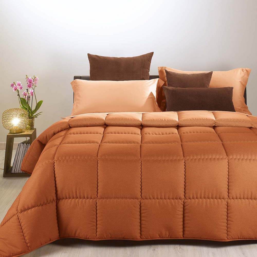 Trapunta invernale Caleffi Tinta Unita Double in microfibra. Piumone double face colore arancio