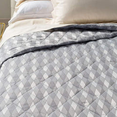 Trapuntino matrimoniale Caleffi Nuit in raso jacquard. Trapunta primaverile con Fantasia moderna a rombi colore grigio