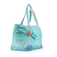 Borsa mare Karakorum Tacoma. Borsa da spiaggia in fantasia con coralli azzurri e bianchi su fondo verde acqua. 
