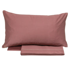 completo lenzuola borbonese lounge tinta unita blush bordeaux con bordino fantasia occhio di pernice a contrasto
