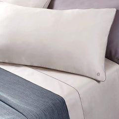 completo lenzuola borbonese lounge tinta unita avorio con bordino fantasia occhio di pernice a contrasto