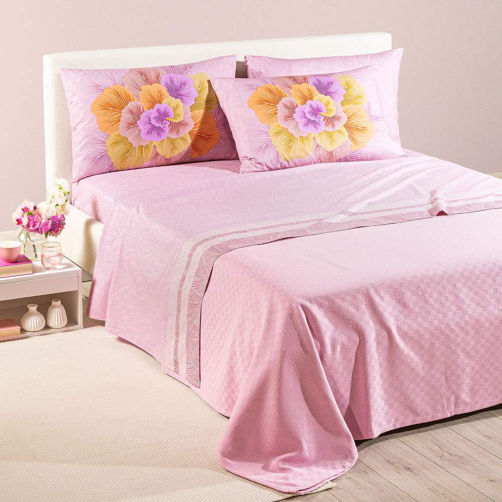 completo lenzuola madreperla caleffi. Federe con grande fiore rosa e arancio. Lenzuola con fantasia rosa a intrecci 