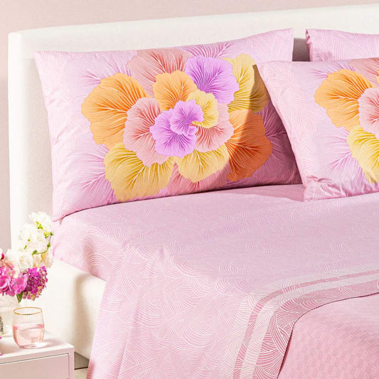 completo lenzuola madreperla caleffi. Federe con grande fiore rosa e arancio. Lenzuola con fantasia rosa a intrecci 