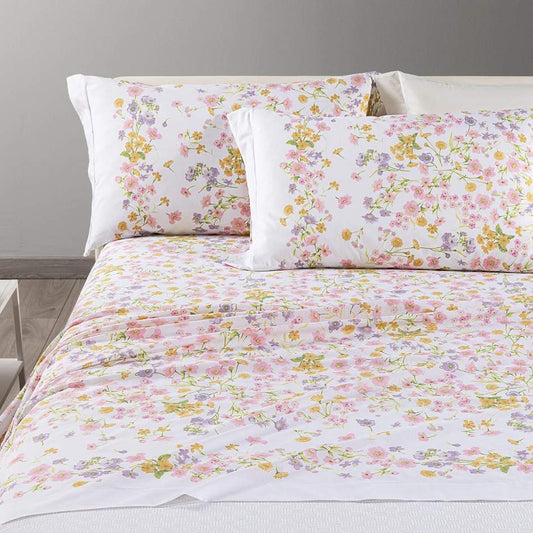 Completo lenzuola Caleffi Provenza in cotone. Fantasia con fiorellini rosa e ocra su fondo bianco.