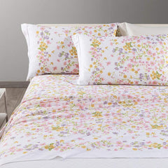 Completo lenzuola Caleffi Provenza in cotone. Fantasia con fiorellini rosa e ocra su fondo bianco.