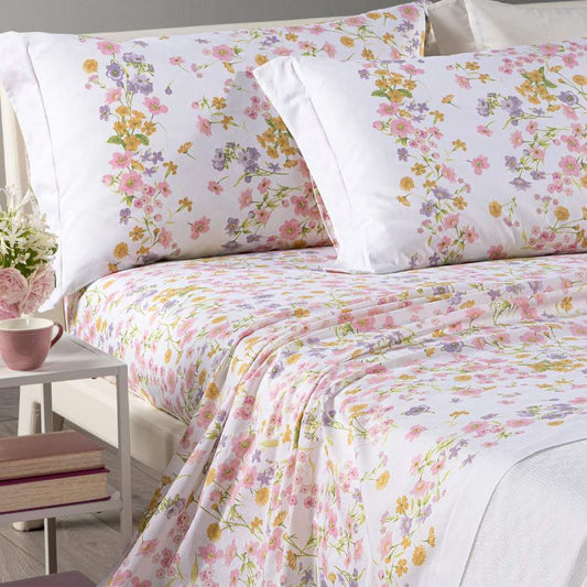 Completo lenzuola Caleffi Provenza in cotone. Fantasia con fiorellini rosa e ocra su fondo bianco.