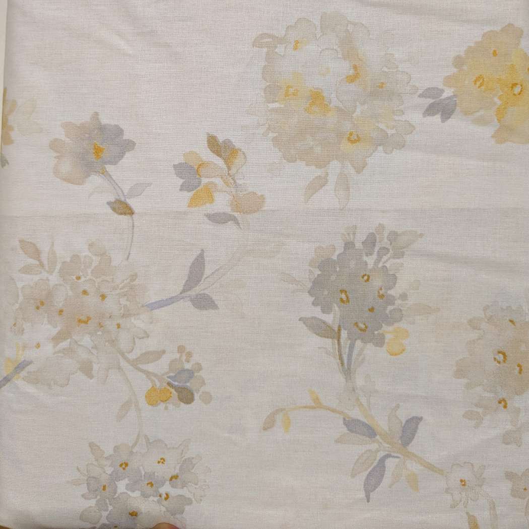Lenzuolo copriletto Graciosa Gabel. Fantasia con fiori gialli su fondo beige