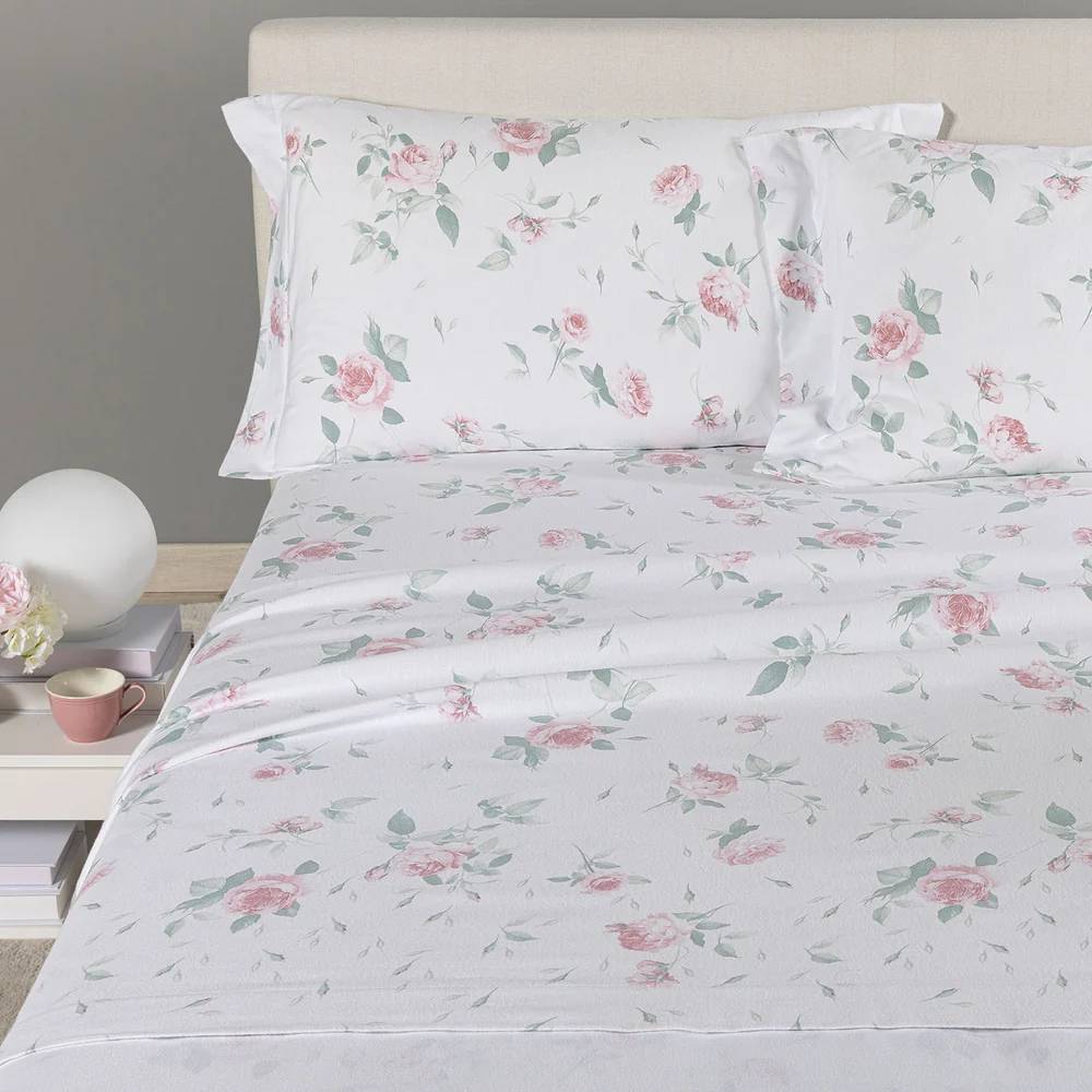 lenzuola Caleffi Rosa in flanella di cotone fantasia con fiori rosa su fondo bianco.