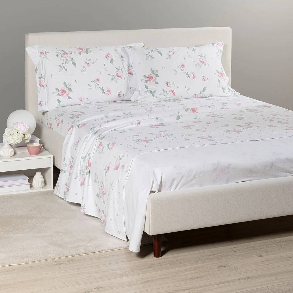 lenzuola Caleffi Rosa in flanella di cotone fantasia con fiori rosa su fondo bianco.