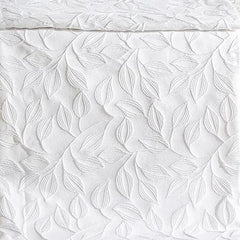 Coperta estiva matera Caleffi in cotone. Fantasia jacquard con foglie bianca