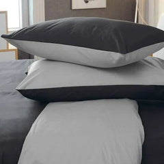 Parure copripiumino tinta unita double face in cotone.  Colore nero e grigio