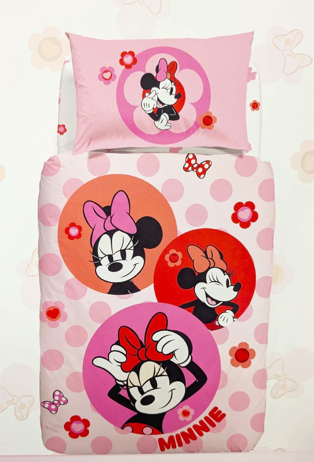 Copripiumino Minnie Flowers in cotone Caleffi Disney. Fantasia con Minnie su fondo rosa a pois.