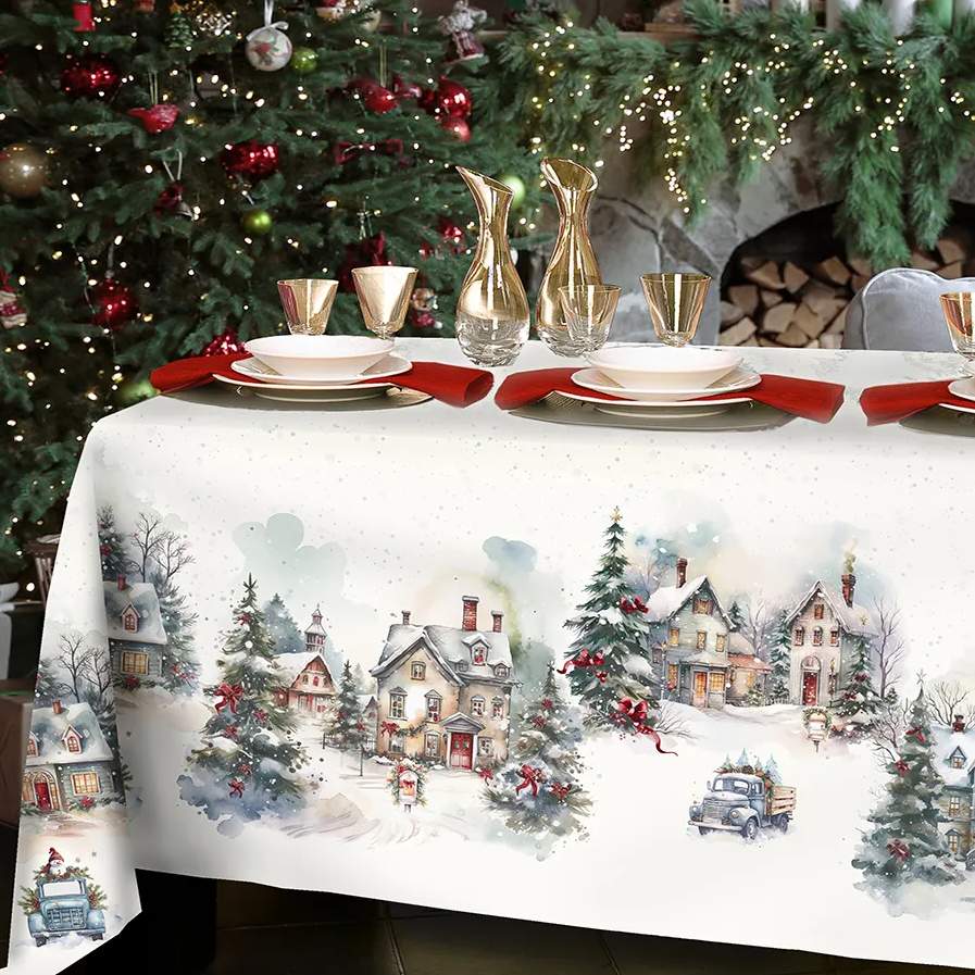 Tovaglia natalizia Frozen di Tessitura Randi in cotone. Fantasia su fondo avorio. Paesaggio con abeti e case innevate. 