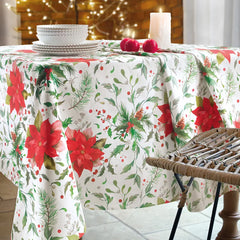 Tovaglia natalizia Stella di Gabel Vallesusa. Fantasia floreale natalizia. Fondo bianco con stelle di natale rosse e foglie verdi.